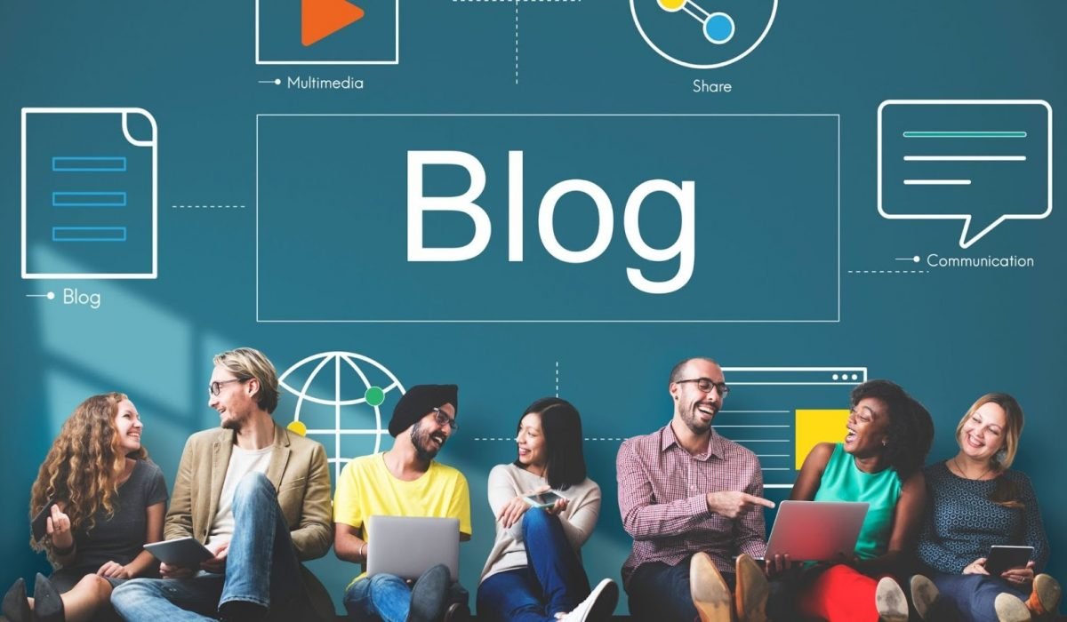 Blog Writing 101 Featured Image which shows team members sitting together brainstorming